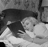 Young woman reading book in bed Poster Print - Item # VARSAL255417024