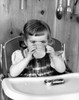 Little girl eating breakfast Poster Print - Item # VARSAL2559712