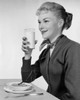Side profile of a young woman eating breakfast Poster Print - Item # VARSAL2552510A