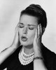 Close-up of a mid adult woman suffering from a headache Poster Print - Item # VARSAL25525138