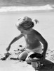 Girl digging sand on beach Poster Print - Item # VARSAL2552656