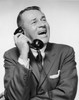 Mature businessman talking on telephone and laughing Poster Print - Item # VARSAL25548239