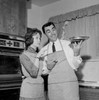 Happy couple cocking together Poster Print - Item # VARSAL255421979
