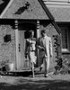 Mid adult couple leaving house Poster Print - Item # VARSAL255422114