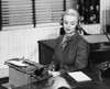 Businesswoman typing on a typewriter in an office Poster Print - Item # VARSAL2554180