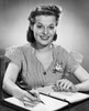 Portrait of a businesswoman writing in a notebook and smiling Poster Print - Item # VARSAL25527969