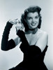 Young woman spraying hair with perfume Poster Print - Item # VARSAL255417232