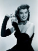 Young woman spraying hair with perfume Poster Print - Item # VARSAL255417232