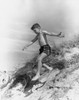 Boy jumping from sand dune Poster Print - Item # VARSAL2557750