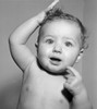 Portrait of naked baby with mouth open and hand raised Poster Print - Item # VARSAL2559514A
