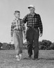 Grandfather and his grandson walking in a park Poster Print - Item # VARSAL25520091B