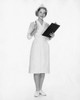 Portrait of a female nurse holding a clipboard and smiling Poster Print - Item # VARSAL25516332