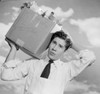 Young man carrying grocery box outdoors Poster Print - Item # VARSAL255422983