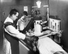 Two radiologists taking an x-ray of a patient Poster Print - Item # VARSAL2556373