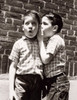 Side profile of a boy whispering to another boy Poster Print - Item # VARSAL25514777
