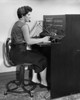 Side profile of a female telephone operator operating a telephone switchboard Poster Print - Item # VARSAL2552213