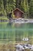 Wooden Cabin Along A Lake Shore PosterPrint - Item # VARDPI1866482