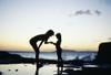 Mother And Daughter Silhouetted In Tidepool At Sunset PosterPrint - Item # VARDPI1994560