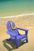 Blue Chair Along Shoreline With Plumeria Lei Hanging On Side PosterPrint - Item # VARDPI2001059
