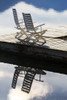 Two white wooden deck chairs on wooden boat dock reflecting in the water; Invermere, British Columbia, Canada Poster Print by Michael Interisano / Design Pics - Item # VARDPI12321668