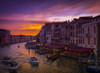 A dramatic and colourful sunset over the canal and buildings, with water taxis in the canal; Venice, Italy Poster Print by Rocco Macri / Design Pics - Item # VARDPI12321984