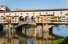 Florence, Florence Province, Tuscany, Italy. Sculler passing under the Ponte Vecchio, or Old Bridge, on the Arno River. Poster Print by Panoramic Images - Item # VARPPI169994