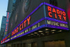 Neon lights of Radio City Music Hall at Rockefeller Center, New York City, New York Poster Print by Panoramic Images - Item # VARPPI181782