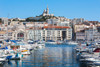 Marseille, Provence-Alpes-Cote d'Azur, France. View across Vieux-Port, the Old Port, to the 19th century Neo-Byzantine Basilica of Notre-Dame de la Garde. Poster Print by Panoramic Images - Item # VARPPI170250