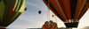 Low angle view of hot air balloons in a balloon festival, Taos Balloon Fiesta, Taos, Taos County, New Mexico, USA Poster Print by Panoramic Images - Item # VARPPI117653