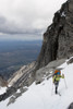 View Of Female Skier By Granite Cliffs Above The Swift River At The South End Of The Revelation Mountains, Summer In Southcentral Alaska Poster Print by Joe Stock / Design Pics - Item # VARDPI2097953