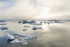 A foggy sunset over the Arctic Ocean illuminates icebergs on a partly clear and calm evening; Barrow, North Slope, Alaska, United States of America Poster Print by Kevin G. Smith / Design Pics - Item # VARDPI12307925