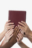 Interracial Hands Holding Up A Bible Poster Print by Design Pics CEF / Design Pics - Item # VARDPI1863884