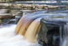 Coloured waterfall flowing over a cliff; Richmond, North Yorkshire, England Poster Print by John Short / Design Pics - Item # VARDPI12324919