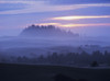 The sun sinks low at sunset with a fog covered landscape; Lakeside, Oregon, United Poster Print by Robert L. Potts / Design Pics - Item # VARDPI2403392