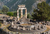 Delphi, Phocis, Greece. The tholos, dating from around 380-360 BC, beside the Sanctuary of Athena Pronaia. Ancient Delphi is a UNESCO World Heritage Site. Poster Print by Panoramic Images - Item # VARPPI170192