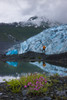 Male Hiker Views Shoup Glacier Standing Next To His Lit Tent, Shoup Bay State Marine Park, Prince William Sound, Southcentral Alaska Poster Print by Kevin G. Smith / Design Pics - Item # VARDPI2164188