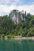 Lake Bled, Upper Carniola, Slovenia. Bled Castle seen across the lake. Tourists enjoying boating excursion. Poster Print by Panoramic Images - Item # VARPPI174212