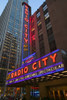 Neon lights of Radio City Music Hall at Rockefeller Center, New York City, New York Poster Print by Panoramic Images - Item # VARPPI181783