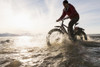 Bicyclist riding his fat bike across a tidal stream along Kachemak Bay, Homer, Kenai Peninsula, Southcentral Alaska, winter Poster Print by Scott Dickerson / Design Pics - Item # VARDPI2433190