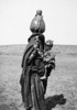 Bedouin Woman & Child. /Na Bedouin Woman Carrying A Child And A Water Jug, From Beersheba, Palestine. Photograph, C1910. Poster Print by Granger Collection - Item # VARGRC0130657