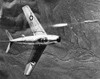 F-86 Jet Fighter Plane. /Nthe North American F-86 Sabre Combat Aircraft Releasing A Rocket During Training Operations Over The Nevada Desert Gunnery Range, 1951. Poster Print by Granger Collection - Item # VARGRC0091268