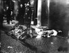 Triangle Factory Fire. /Npolice Officers And Civilians On The Sidewalk With The Bodies Of Victims Of The Triangle Shirtwaist Factory Fire. Photograph, 25 March 1911. Poster Print by Granger Collection - Item # VARGRC0395116