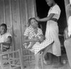 Migrant Family, 1936. /Nan African American Woman Braids Another Woman'S Hair While She Cradles Her Baby, Earle, Arkansas. Photograph By Dorothea Lange, July 1936. Poster Print by Granger Collection - Item # VARGRC0106547