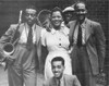 Billie Holiday (1915-1959). /Namerican Singer. In A Harlem Alley With Ben Webster (Left) And Other Musicians. Photographed In 1935. Poster Print by Granger Collection - Item # VARGRC0064870