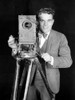 Movie Camera, 1920S. /Nthe Actor Nick Stuart In A Publicity Still From The 1920S Silent Film 'The News Parade.' Poster Print by Granger Collection - Item # VARGRC0032301