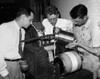 Nylon Development. /Ndu Pont Scientists Pour An Experimental Solution Into A Machine, While Working To Develop The Synthetic Textile, Nylon. Photograph, Early 20Th Century. Poster Print by Granger Collection - Item # VARGRC0121664