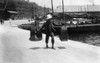 China: Hong Kong, C1900. /Na Chinese Worker Carrying Two Heavy Sacks On Pole Across His Shoulders On The Waterfront In Hong Kong, China. Photograph, C1900. Poster Print by Granger Collection - Item # VARGRC0115993
