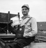 Wwii: Homefront, 1943. /Na Worker Holding A War Bond At The Bethlehem-Fairfield Shipyard In Baltimore, Maryland. Photograph By Arthur Siegel, 1943. Poster Print by Granger Collection - Item # VARGRC0259555