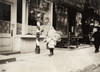 Hine: Home Industry, 1912. /Na Young Girl Carrying A Bundle Of Kimonos For Home-Work On Thompson Street In New York City. Photograph By Lewis Hine, February 1912. Poster Print by Granger Collection - Item # VARGRC0167521