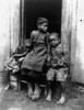 African American Children. /Nthree African American Children Seated In A Doorway. Photograph, C1901. Poster Print by Granger Collection - Item # VARGRC0120063